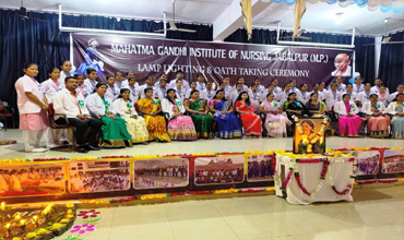 A picture of students & teachers gathered for the lighting and oath taking ceremony conducted in Mahatma Gandhi Institute of Nursing.