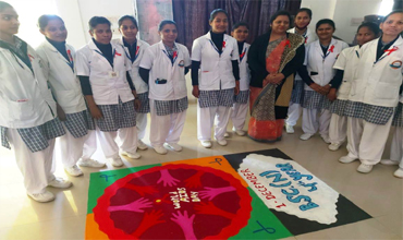 Group of Students standing around their rangoli design.