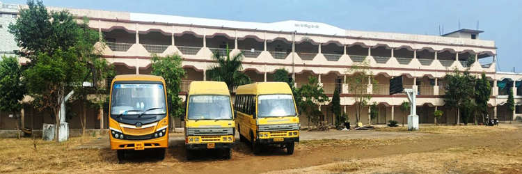 Three Yellow buses standing in front of Mahatma Gandhi Institute of Nursing.